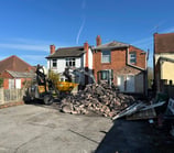 Hydraulic breaker removing concrete in Birmingham