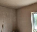 CORNER OF A PLASTERED ROOM