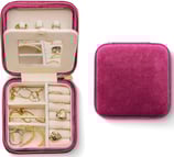 a jewelry box with a pink velvet case