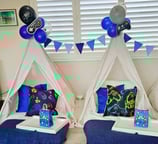 teepee slumber hire game night theme with balloon decorations and garland