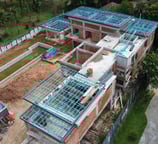 A 15,000 square foot built-up area Bangalow construction project by Shockwave Builders.