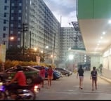 a group of people walking down a street