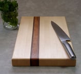 a knife and a knife on a cutting board