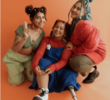 Young female friends supporting their friend who has a leg amputation