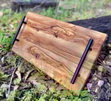 a wooden cutting board with a wooden cutting board