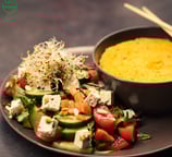 a bowl of vegan food with a bowl of soup