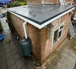 Finished garage roof renovation from back