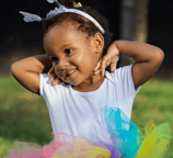 Adorable young ballerina outside