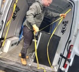 a man loading the back of a van