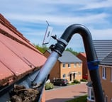 leaves being vacuumed out of a guttering in droitwich