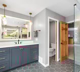 Bright bathroom remodel with updated lighting and stylish tile work