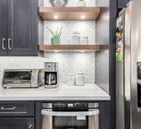 Bright kitchen design with durable quartz countertops and premium stainless steel appliances