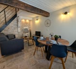 a dining room table with chairs and a couch