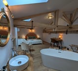a bathroom with a bathtub and a sink