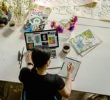 Creative businesswoman drawing digitally