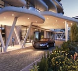 Front entrance of W Cairo Hotel at One Ninety with a luxury Bentley parked at the valet drop-off.