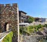 a stone wall with a bridge and a bridge over it