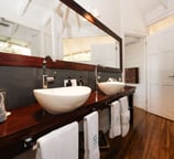 a bathroom with a large mirror and a sink