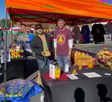 two men standing in front of a table with a table with a table cloth
