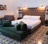 a bed room with a bed and a couch