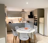 a kitchen table with a table cloth on it
