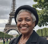 Older African American Woman in front of the Eiffel Tower