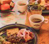 a plate of food and a cup of coffee
