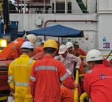 a group of people in red and yellow uniforms