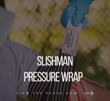 a person in gloves holding a pressure bandage