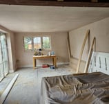 Plastering a living room wall in Worcester, smooth finish by local experts D and N Plastering.