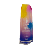 a bottle of watermelon with a colorful rainbow - colored background