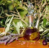 olive oil flask with olives and lavender
