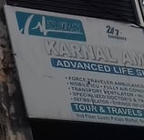 An image showing a board with details of Karnal Ambulance Service in Karnal