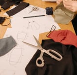 Fabric sourcing and layout for low MOQ clothing production