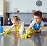 children helping clean the kitchen