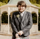 a man in a kiltrum kilt and a kilt