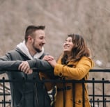 a man and woman standing next to each other