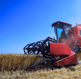 a red tractor with a red tractor in the background