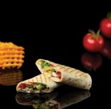 Chicken vegetable lavash shawarma cut into two pieces