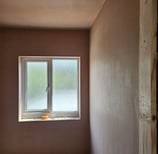 WINDOW IN A FRESHLY PLASTERED ROOM