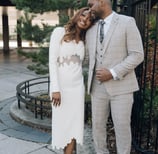 a bride and groom standing next to each other