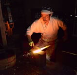 Japanese Blacksmith forging a katana