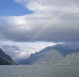 Sognefjord with clouds and rainbow Norway