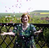 Celebrant throwing wedding confetti