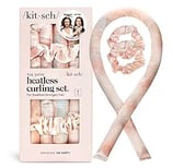 a kit with a pink ribbon tied to a ribbon