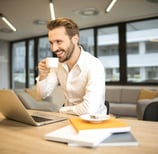 Businessman-drinking-coffee-and-enjoying-life