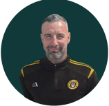 a man with a beard and a black jacket