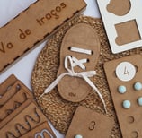 a variety of personalized wood items that include games and didactic material