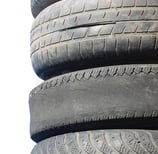 Worn out car tyres in a tire repair shop Nigeria