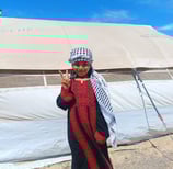 little Palestinian  girl with victory sign